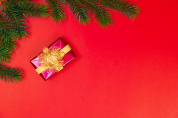 Christmas background concept. Top view of Christmas gift box gold balls with spruce branches