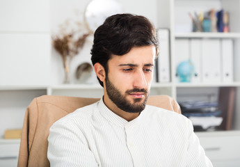 Portrait of young cheerful businessman