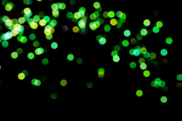 big green and golden bokeh for background on black. Christmas lights. overlay layer