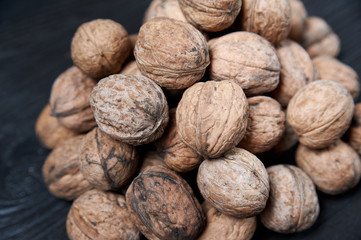 walnut on a black wooden background still life, walnut