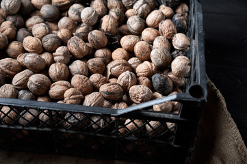 walnut on a black wooden background still life, walnut