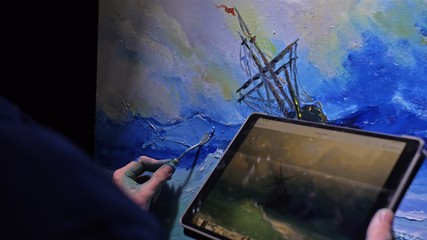 Artist copyist paint seascape with ship in ocean. Craftsman decorator draw as boat sail on blue sea...