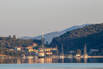 Sailing yacht in the bay in the early morning. Greece. Khalkidhiki
