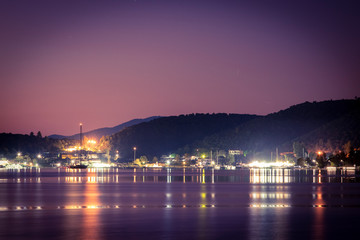 Obraz premium Sailing yacht in a quiet bay at night. Greece. Khalkidhiki