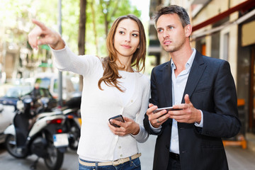 Guy and girl strolling through city streets