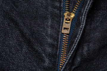Close up of zipper on black jeans