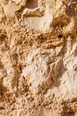 Wall sandstone texture background. Yellow old grunge surface, stone vintage texture. Voluminous background