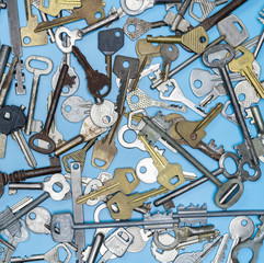 Keys set on blue background. Door lock keys and safes for property security and house protection....