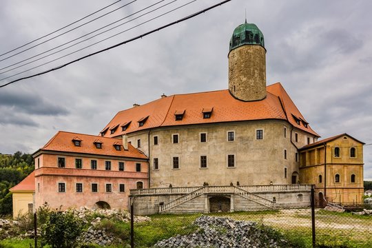 Liba / Czech Republic - September 13 2019: View of newly reconstructed castle at Liba from 13th century with new red roof and a new facade on a cloudy day. 