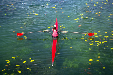 Woman Single sculls rower during the start of a rowing