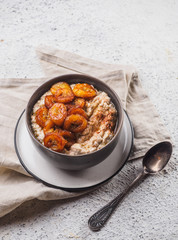 Oatmeal with fried banana. White background table
