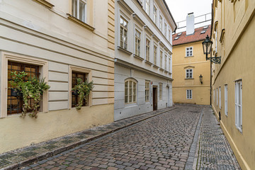 Old street view in Prague, Czech Republic.  Deserted street with paving stones