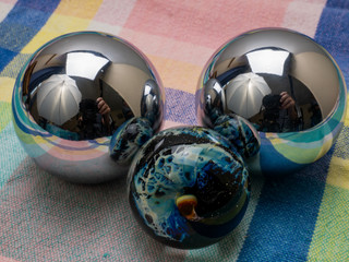 Three Reflective Orbs of Steel and Glass Still Life