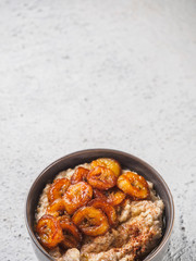 Oatmeal with fried banana. White background table