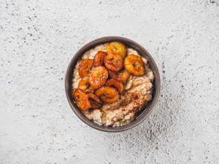 Oatmeal with fried banana. White background table