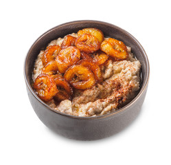 Oatmeal with fried banana. White isolated background