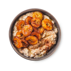 Oatmeal with fried banana. White isolated background