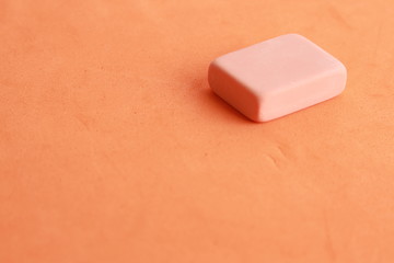 pink eraser on colorful background