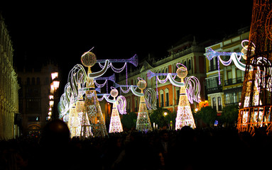 Christmas decorations in the Plaza San Francisco in Seville, Andalusia,  Spain.  Angels with trumpets.  Show of lights and music.