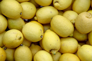 Colorful Display Of Lemons In Market