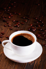 a cup of espresso on a wooden table
