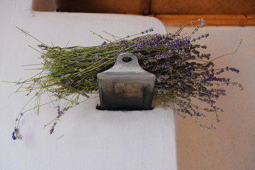 Rustic oven with open smoked damper and dry lavender on top.
