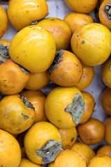 Persimmon on shelf in supermarket