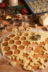 Cutting out star shapes for traditional Linzer Christmas cookies