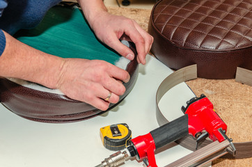 Seat upholstery in a furniture workshop, eco-leather cover