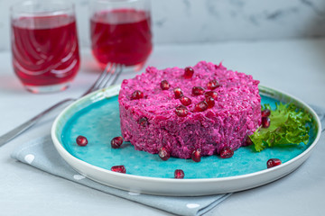Holiday salad of beets and soft cheese in glasses. Added sesame seeds and chanok.