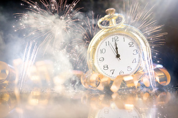 Naklejka na ściany i meble Festive holiday background with clock showing Midnight at New Years Eve.