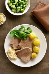 Boiled beef with potatoes and horseradish