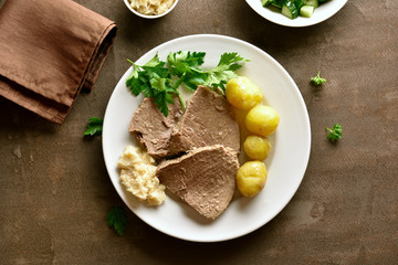Boiled beef with potatoes and horseradish