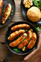 Roasted sausages in frying pan