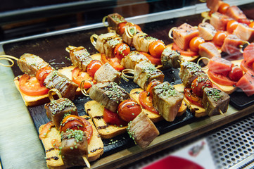 A wide variety of traditional tapas with seafood in Spain at the San Miguel market