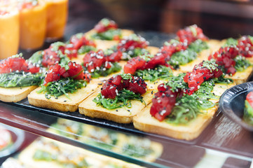 A wide variety of traditional tapas with seafood in Spain at the San Miguel market