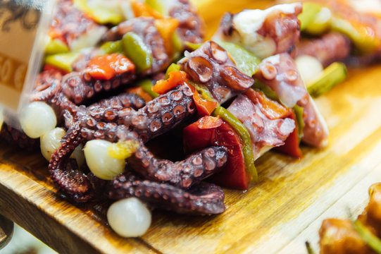A wide variety of traditional tapas with seafood in Spain at the San Miguel market