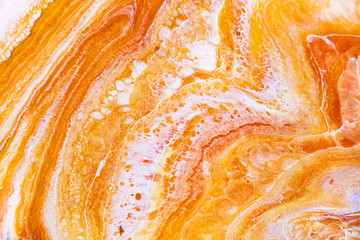 Burnt orange liquid and white foam mixing raster background. Colorful fluid splashes realistic...