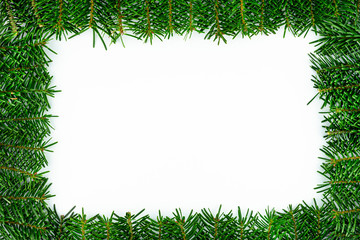 Fototapeta na wymiar A frame made of fir branches, isolated on a white background.