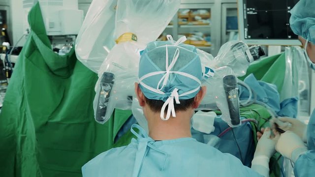 Surgeon performs surgery on human skull through electron microscope