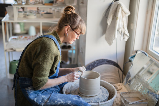 Potter using potters wheel