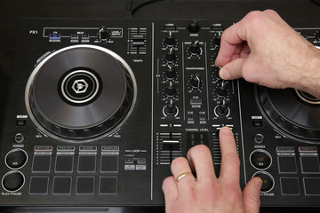 hand of dj in action. Music background, banner, card. Close-up.