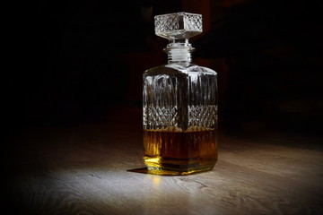 bottle of whiskey on black background