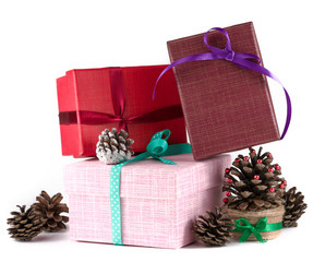 Christmas gift boxes with cones on white background