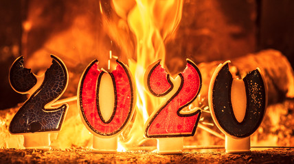 New year 2020 with fire in the background making the new year a beautiful and hopeful future with new thoughts and new prospects without violence and war in the world. - Powered by Adobe
