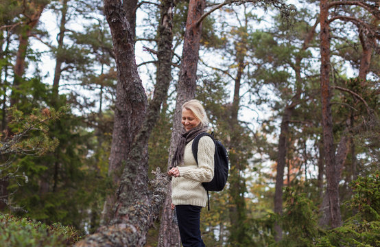 Smiling woman in forest