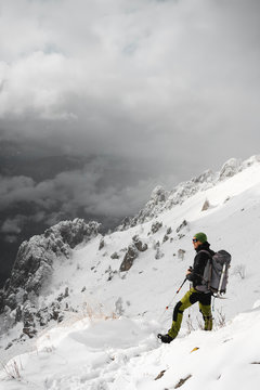 Mountaineer looking at distance, Italian Alps, Lecco, Lombardy, Italy