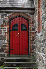Front red door of vintage house, Kinsale, County Cork, Ireland - 310038028