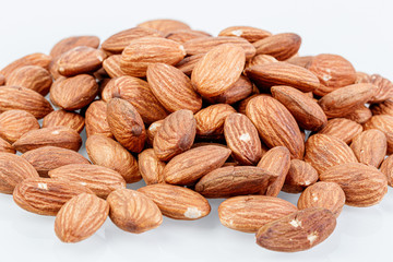macro almond nuts on a white background