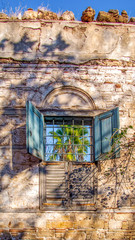 close up retro style old house window of Mediterranean architectural culture in Alacati town of Antalya, Turkey